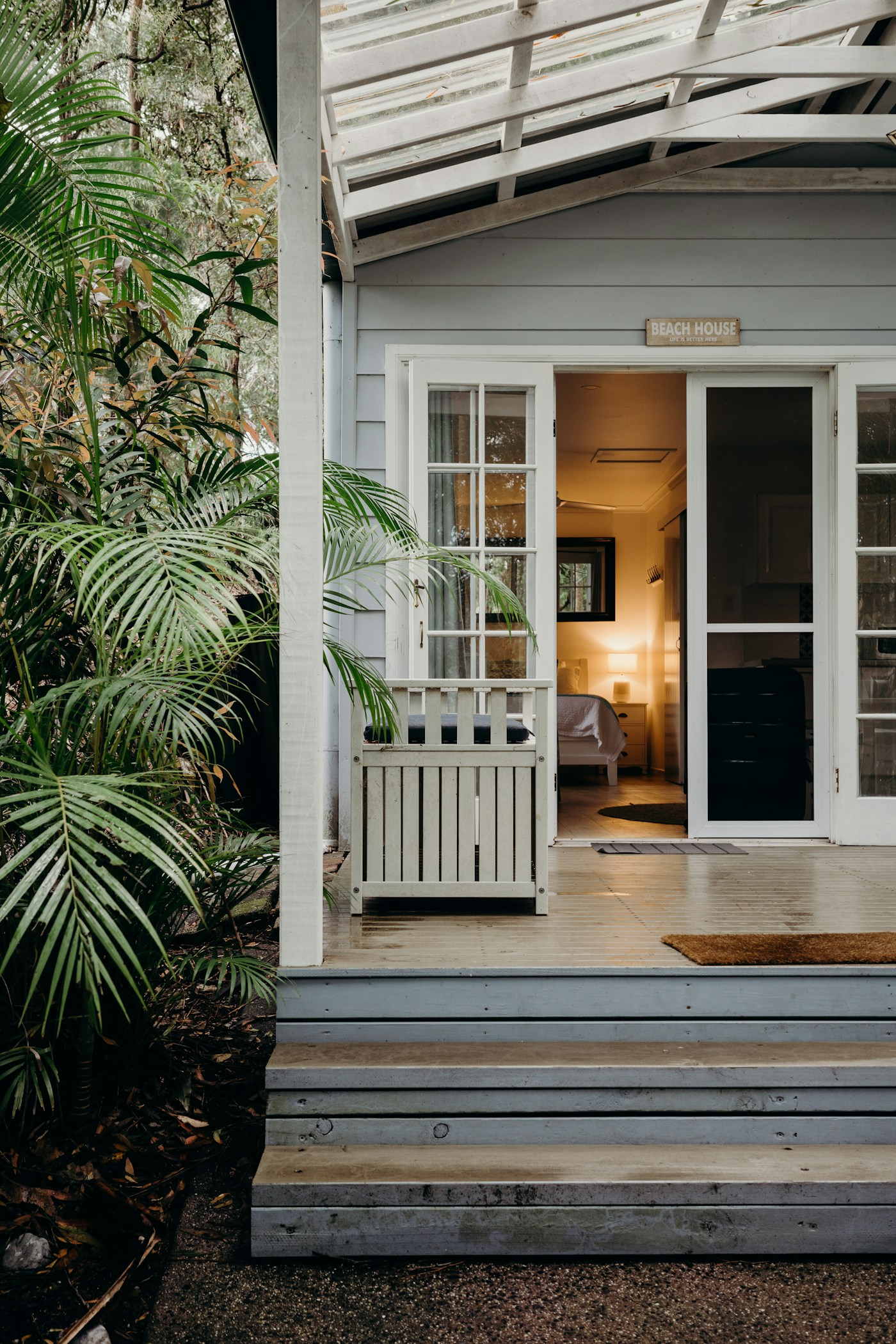A porch with timber steps and an entrance